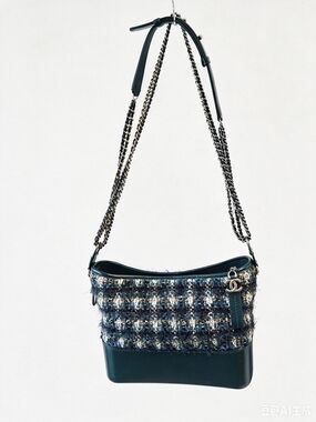 a Chanel Tweed Gabrielle Bag